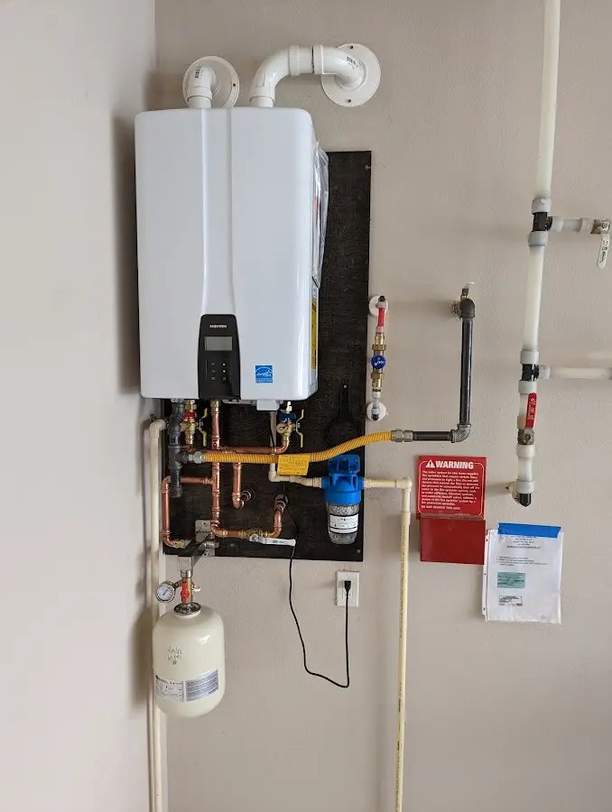 Professional plumber installing copper piping in a Nassau Bay home